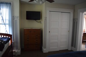 First floor bedroom TV and closet