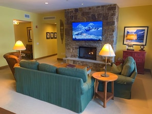 The living room has a Queen-size sleeper sofa and beautiful gas fireplace.