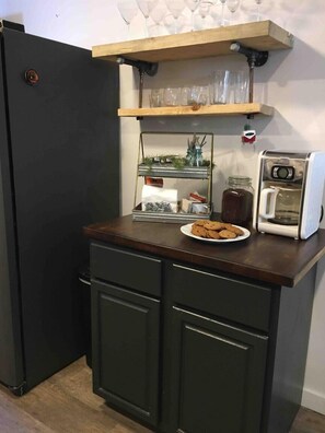 Coffee Bar, full refrigerator, coffee maker, pour over, coffee, cream, etc