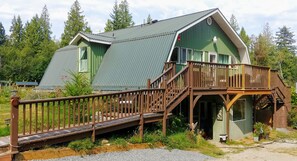 The suite is the top floor of the big barn-shaped house, separate entrance.