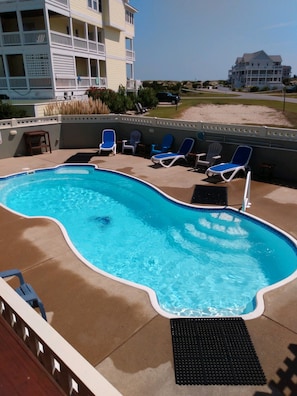 Spacious pool area.  Custom loungers.