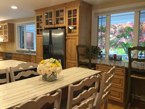 Gourmet kitchen with coffee bar.