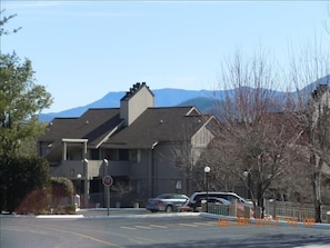 One building in the complex with mountain view in background.