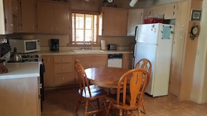 Fully equipped kitchen and dining area.