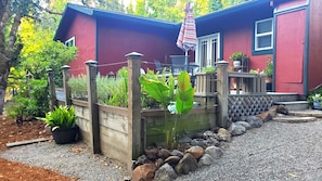 A view of the back patio and gravel pathway.