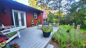 An alternative view of the back patio, focusing on the door and the table.