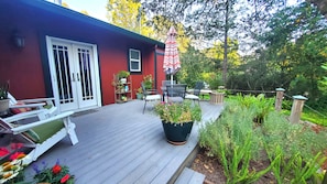 An alternative view of the back patio, focusing on the door and the table.