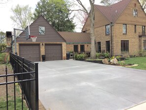 Spacious Driveway houses up to 4 cars and has basketball court