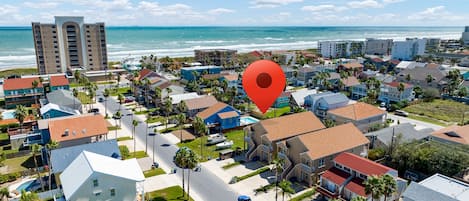 Aerial view of the property with the Beach just steps away!