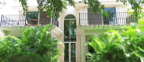 Private patio in rear of house leads to the common area with Palapa and pool.