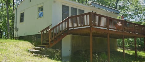 View of rear of house, showing full length deck.