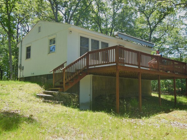 View of rear of house, showing full length deck.