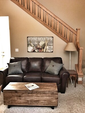 Main floor seating area with queen sleeper sofa
