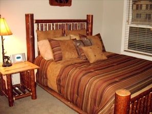 Guest Bedroom with Rustic interior design