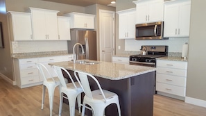 Kitchen with bar seating.