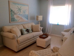 Family room with queen sleeper sofa and TV. Plenty of gathering areas here!