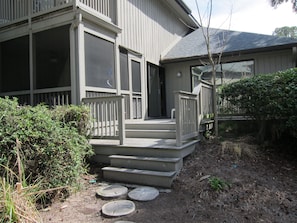 Back Patio and screened in poarch leading to pool