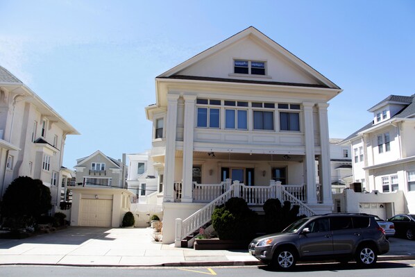 4-car driveway! Large fenced yard, lots of outdoor seating! Outside shower.