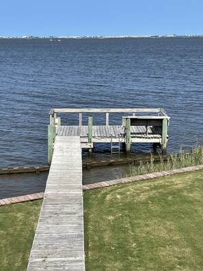 Private dock with fishing table and benches.