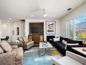 TV in the living room and cozy fireplace for chilly mornings