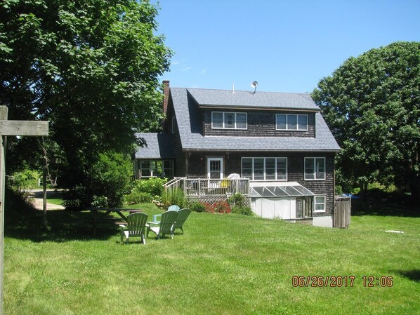 back yard with picnic table, great for croquet other games