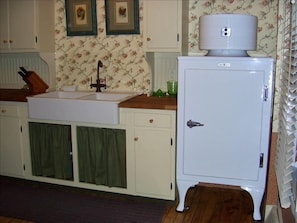 Charming 1930's farmhouse kitchen with restored 1935 GE monitor top refrigerator