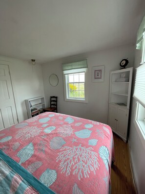 Master bedroom with queen bed, view of dunes