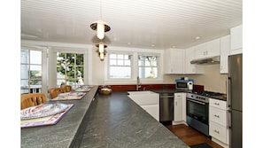 Handsome stone counters and bar tier for drinking and dining.