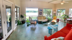 Sunroom offers 180-degree panorama of lake & mountains, plenty of room to relax