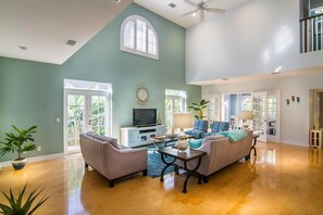 HUGE great room with soaring ceilings and 65" TV