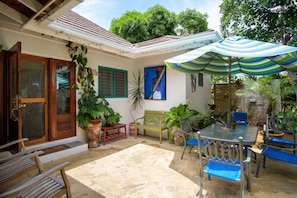 Spacious private back patio with Umbrella table and chairs