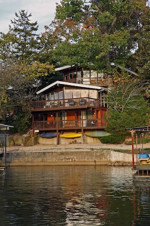 Top two levels are wall-to-wall floor-to-ceiling windows to beautiful lake views