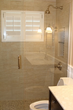 Newly updated upstairs guest bath with 2 shower heads in extra long shower
