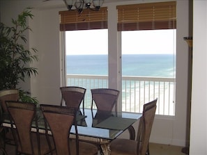 Generous dining area with beach views