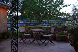 Enjoy dinner and wine on the patio under the string lights