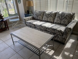 New pull out couch and loveseat and new coffee table in living room-May 2023