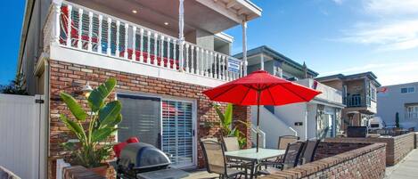 Our coveted 35th Street downstairs patio provides ocean views from the front patio, four houses back from beachfront and boardwalk; includes outdoor dining, propane bbq grill, market umbrella.