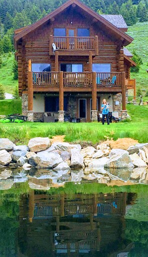 View of cabin and yard from the lake.
