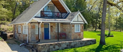 Original Swiss Architecture with covered porches on both levels over looking the lake