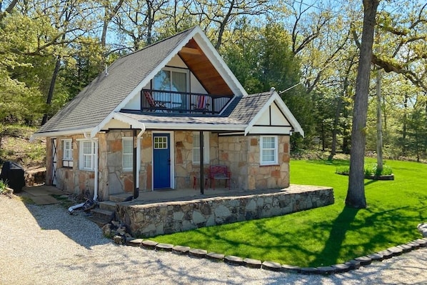 Original Swiss Architecture with covered porches on both levels over looking the lake