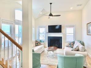 Living Room On 2d Floor With 55" Smart TV, Fireplace And Veranda Overlooking Bay