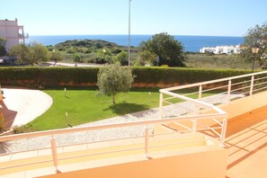 Large veranda, with sea view and shared pool view, is accessed from all rooms