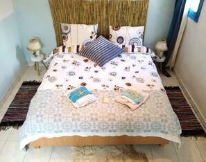 The bedroom is just as sunny and cheerful, vibrant in colours