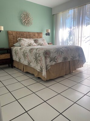 Queen bed. TV, AC, sliding glass door, louver window, dark out curtains & sheers