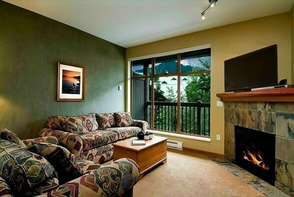 Relax in front of the fire. We provide cable TV and a selection of Games & DVD's