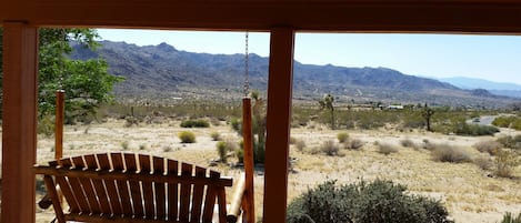 West facing bench swing has amazing sunset views!