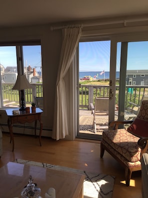 Living room view across upper deck and out to the  ocean.