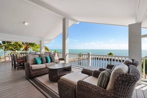 Spacious covered deck for entertaining overlooking the Atlantic Ocean