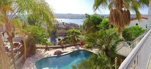 panoramic shot of pool, jacuzzi, 360 degree mountains, and view near sunset 