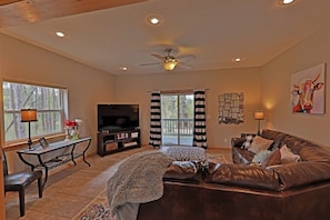 Main level family room with deck, 50' TV, and Wii